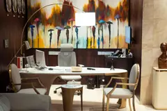 Modern office reception featuring vibrant wall art and contemporary furniture
