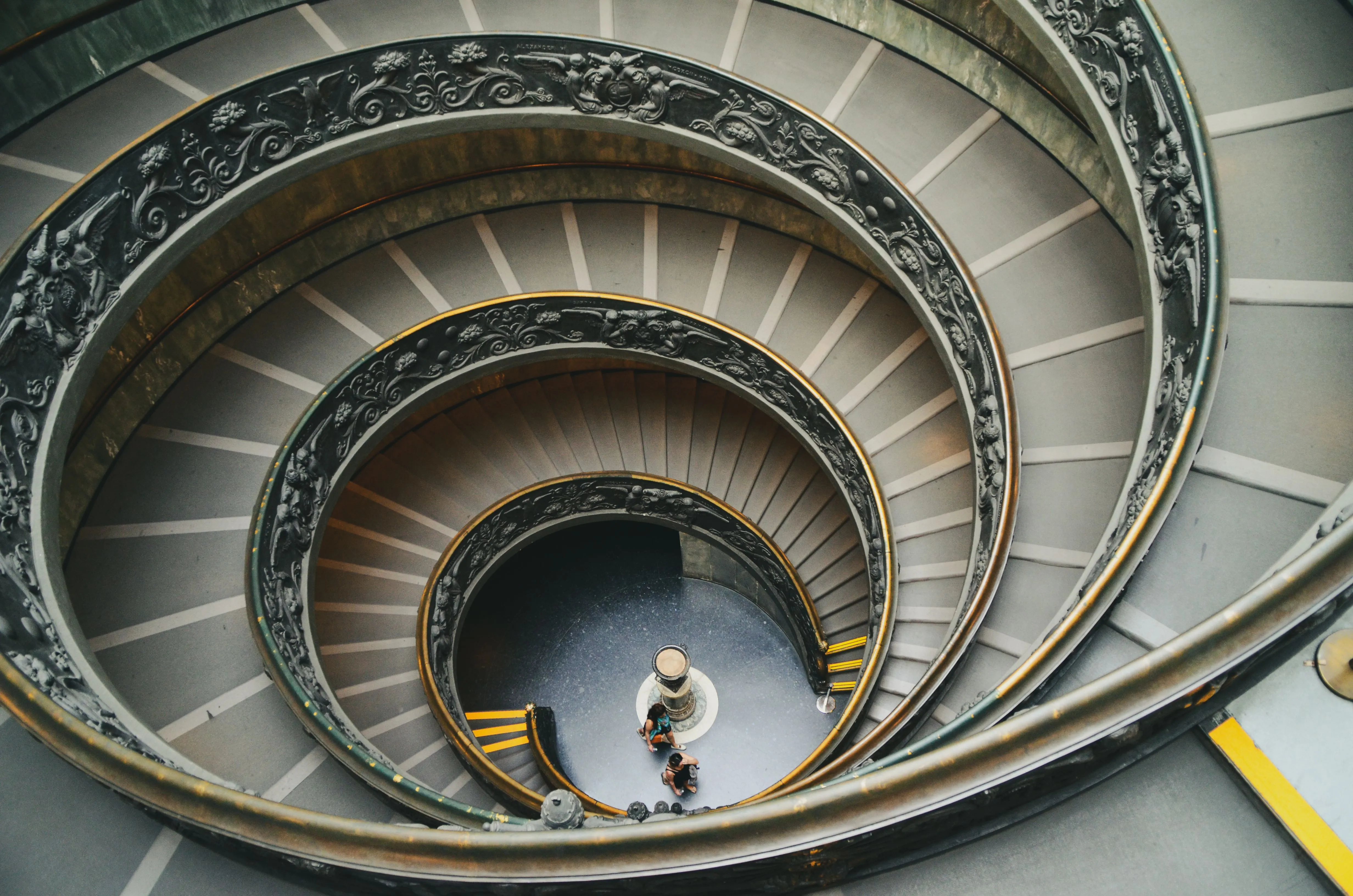 The Bramante spiral staircase seen from above, green marble and ornamented iron railings