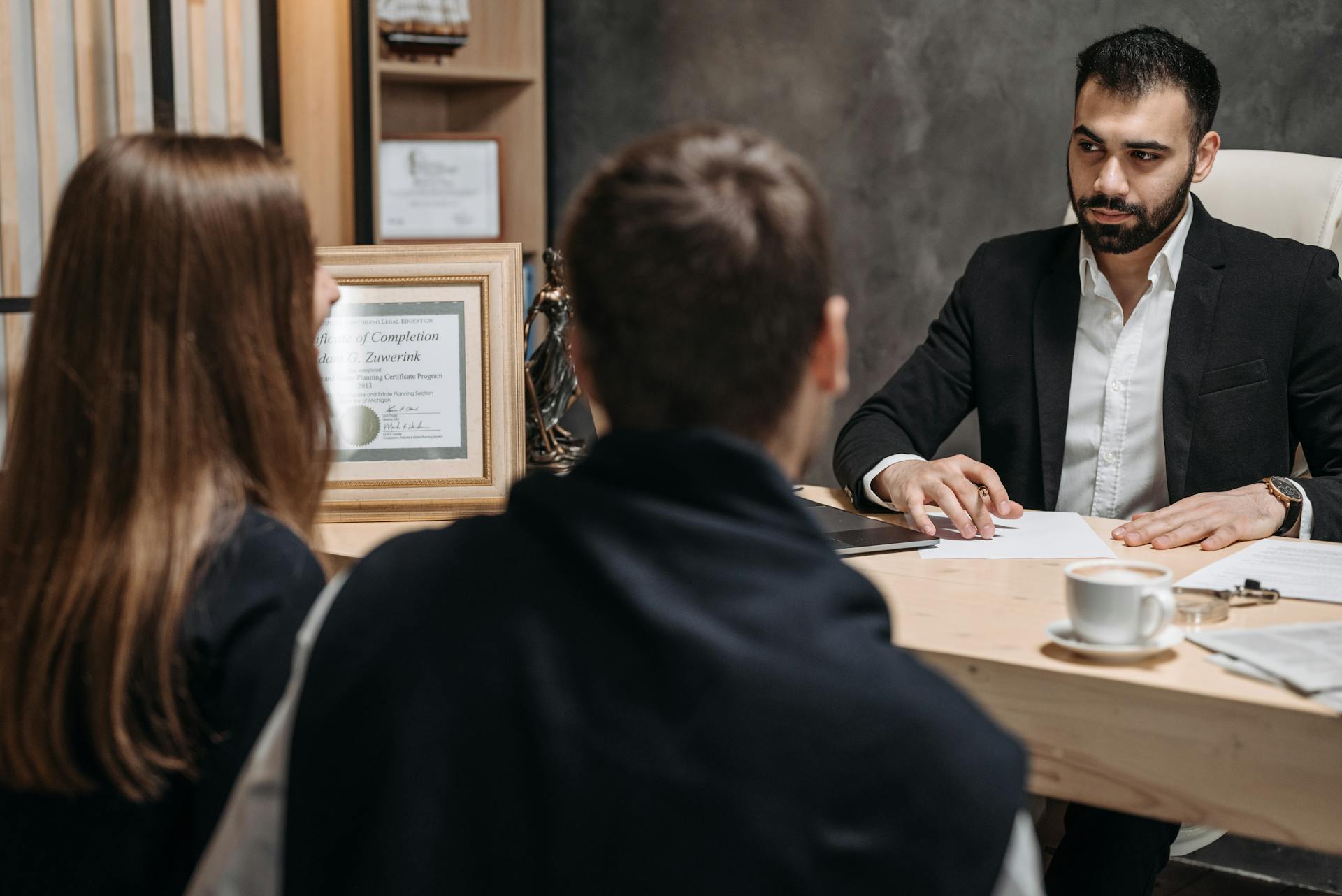 Legal professionals reviewing asset documentation